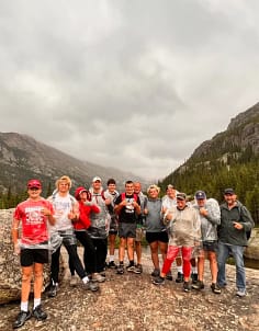 group hiking in the rain in Rocky Mountain National Park