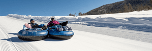 a couple snow tubing