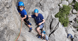 dad and son climbing the in Boulder