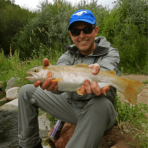 man caught a trout fly fishing