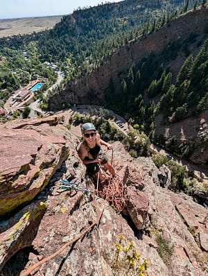 woman climbing with Colorado Climbing Company