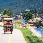 Riding a bench pedal cart around Lake Estes