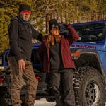 man and woman outside jeep