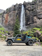 Telluride Offroad Adventures Jeep in front of Bridal Veil Falls