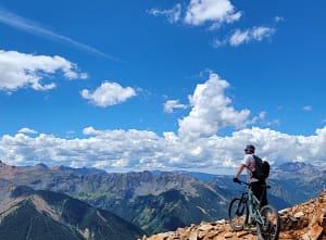 ebike rider overlooking mountain view in telluride